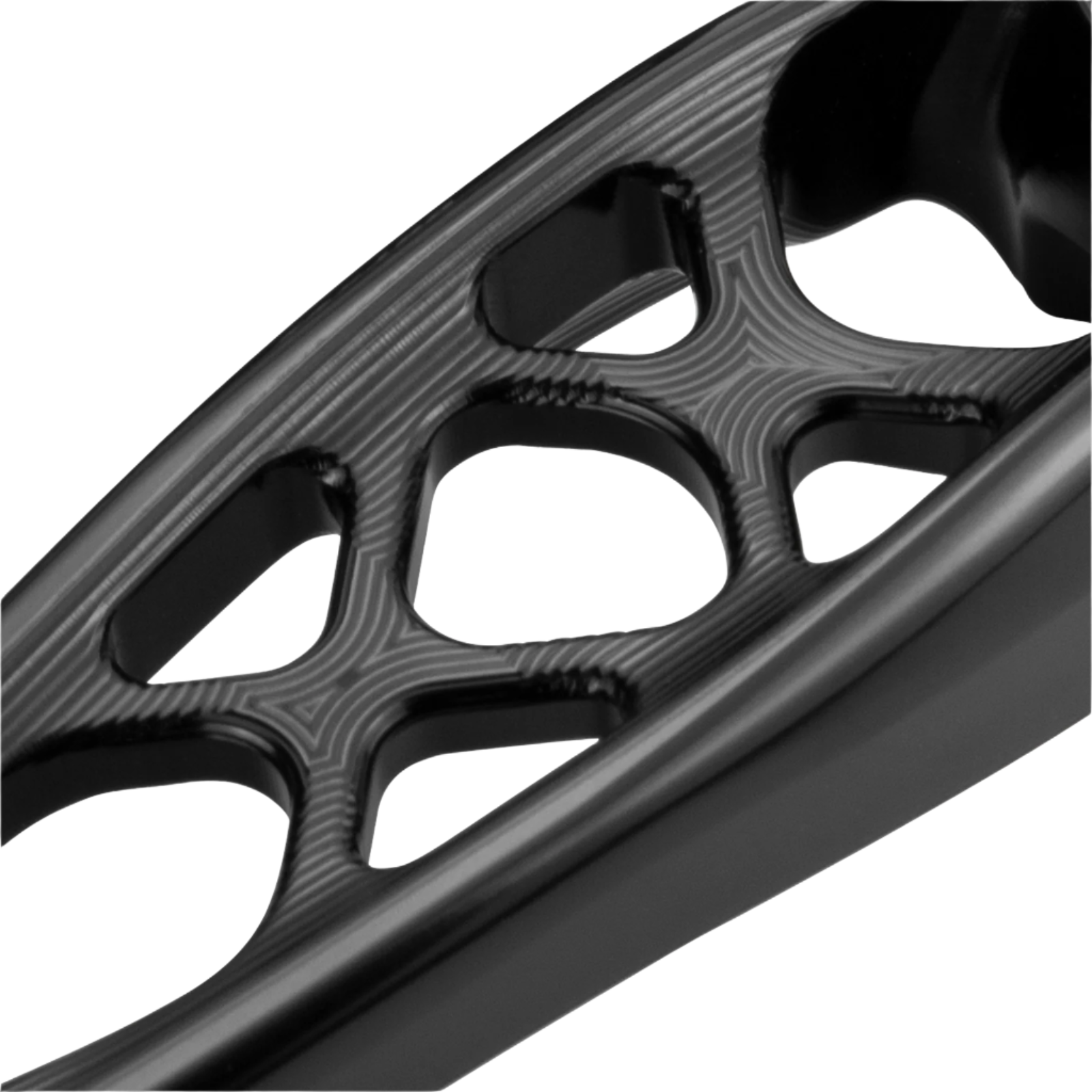 Close-up of a black, intricately designed metal component on a white background